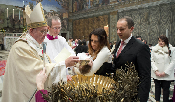 Pope Francis baptizes infant in Sistine Chapel at Vatican