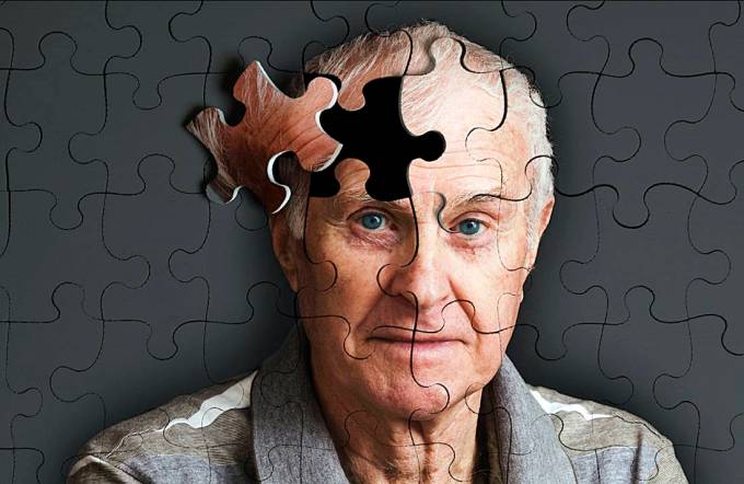 Jigsaw puzzle, of senior man, falling apart